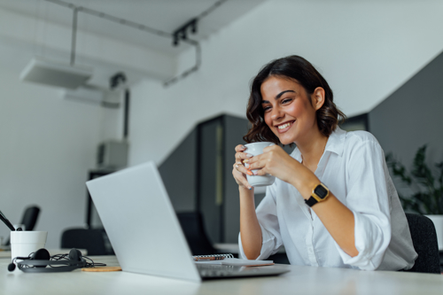 Woman with laptop and coffee