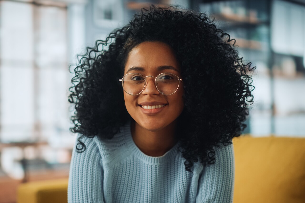 Woman smiling after overcoming HR challenges