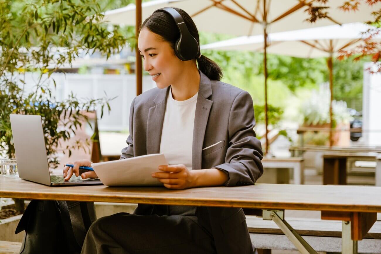 Young woman working on her CIPD qualification at a coffee shop
