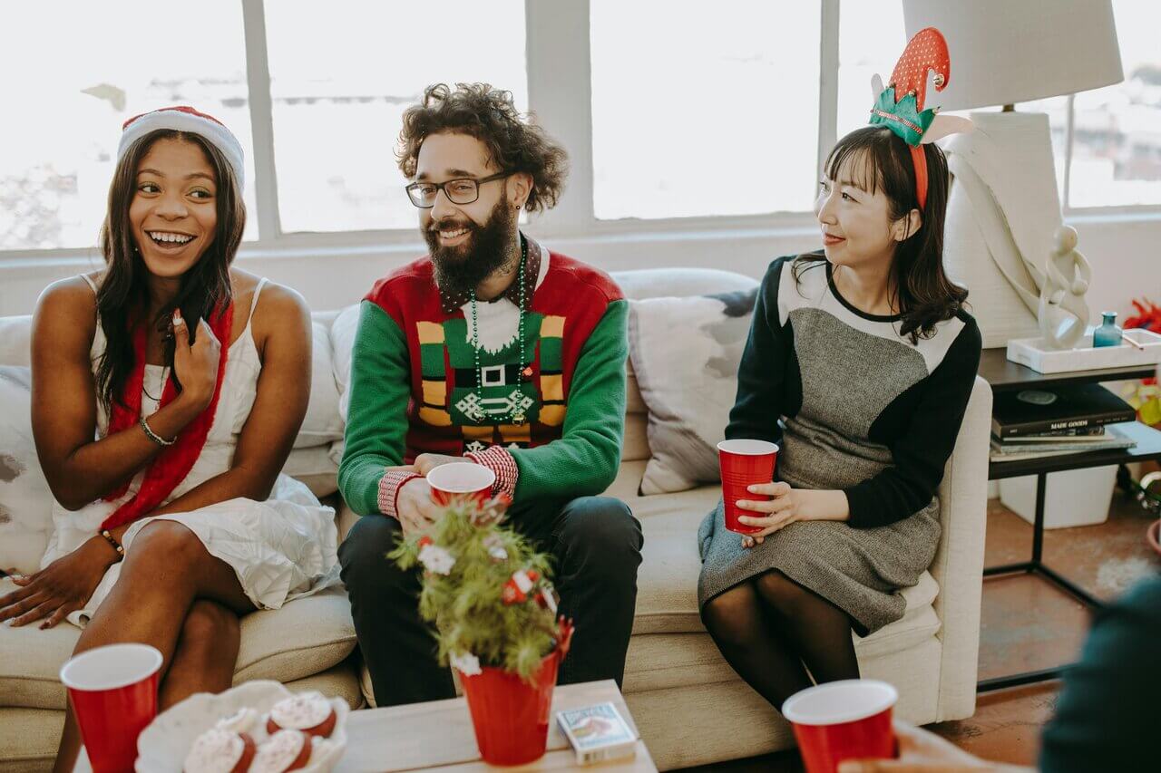 coworkers chatting about presents at the christmas party