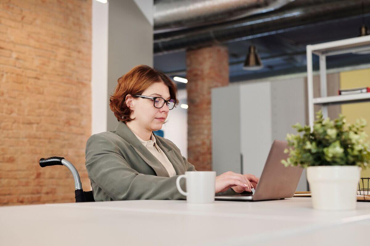 Disabled woman working on a laptop